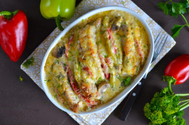 Pork with mushrooms and cheese in the oven