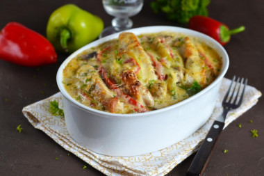 Pork with mushrooms and cheese in the oven