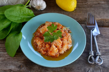 Fish in tomato sauce with onions and stewed carrots