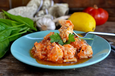 Fish in tomato sauce with onions and stewed carrots