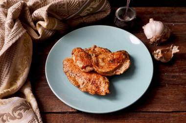 Juicy chicken breasts in a frying pan