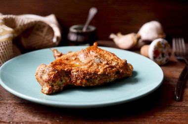 Juicy chicken breasts in a frying pan