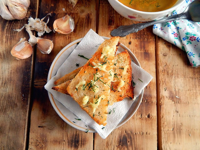 White bread with garlic in a frying pan