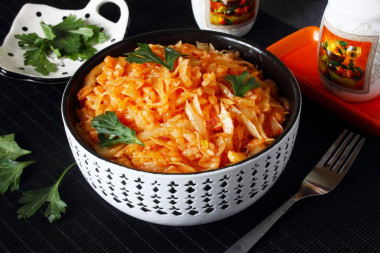 Stewed cabbage with rice in a frying pan