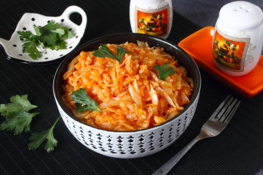 Stewed cabbage with rice in a frying pan