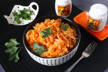 Stewed cabbage with rice in a frying pan