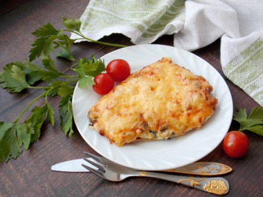 Chop with mushrooms and pork cheese in the oven