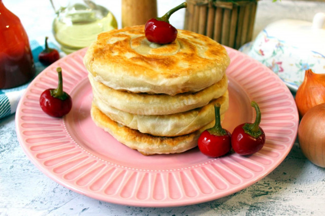 Puff pastry in a frying pan with onions