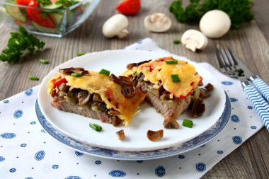 French pork meat with mushrooms in the oven