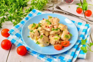 Chicken in sour cream sauce in a frying pan