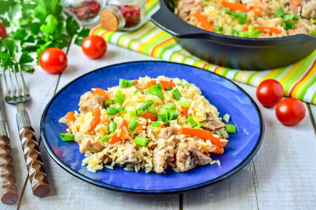 Rice with chicken in a frying pan