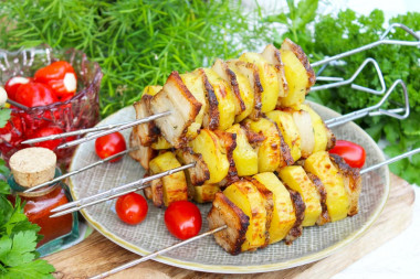 Potatoes on the grill in foil with bacon