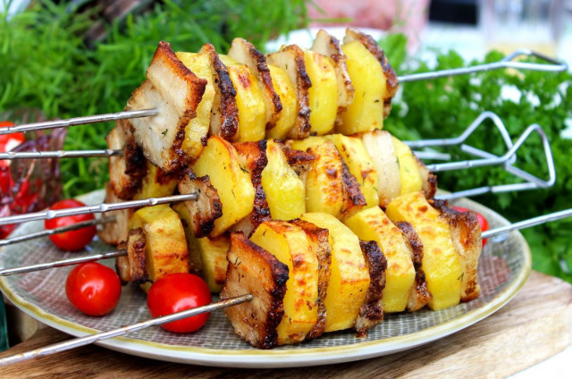 Potatoes on the grill in foil with bacon