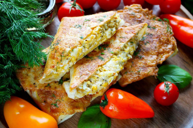 Lavash with egg and cheese in a frying pan