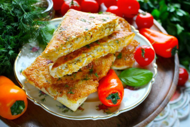 Lavash with egg and cheese in a frying pan