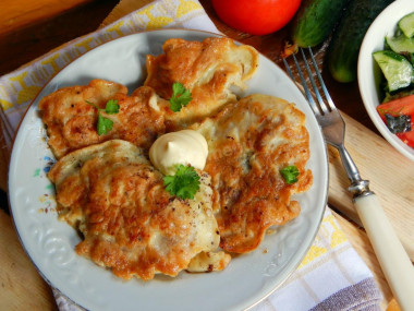 Chicken fillet chops in a frying pan in batter