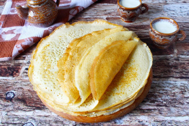 Pancakes with yeast and milk with holes