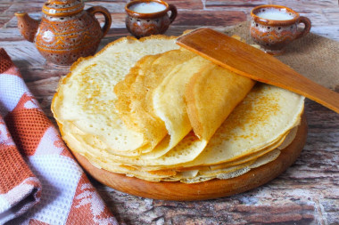 Pancakes with yeast and milk with holes