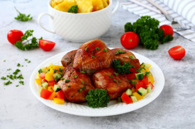 Chicken breasts in soy sauce in a frying pan