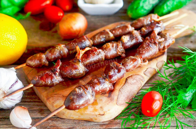 Barbecue chicken hearts on the grill