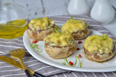 Mushrooms stuffed with chicken and cheese in the oven