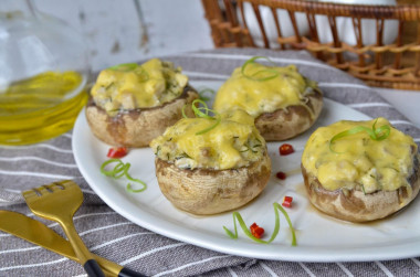 Mushrooms stuffed with chicken and cheese in the oven