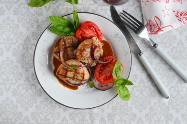 Pork medallions in a frying pan - pork tenderloin