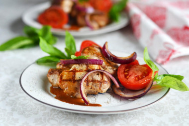 Pork medallions in a frying pan - pork tenderloin