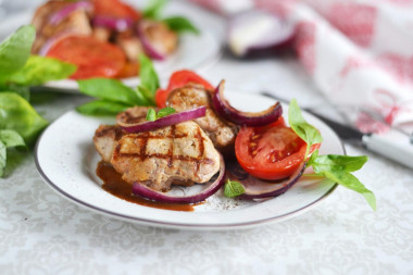 Pork medallions in a frying pan - pork tenderloin