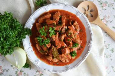 Roast pork with gravy in a frying pan