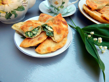 Pies with egg on kefir in a frying pan