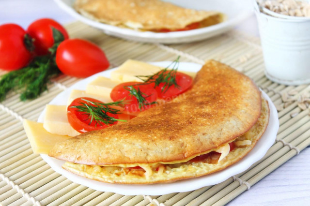 Oatmeal with cheese and tomatoes