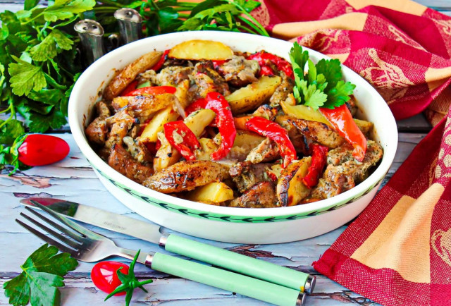 Pork in the oven with vegetables and baked potatoes