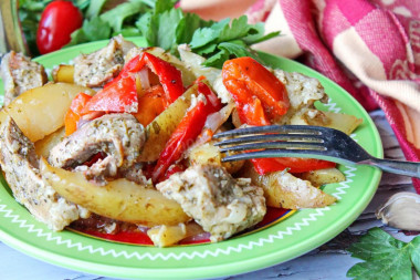 Pork in the oven with vegetables and baked potatoes