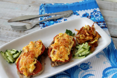 Pork mushrooms tomatoes cheese in the oven