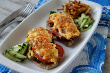 Pork mushrooms tomatoes cheese in the oven