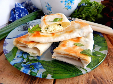 Pita bread envelopes in a frying pan