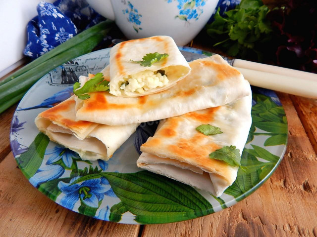 Pita bread envelopes in a frying pan