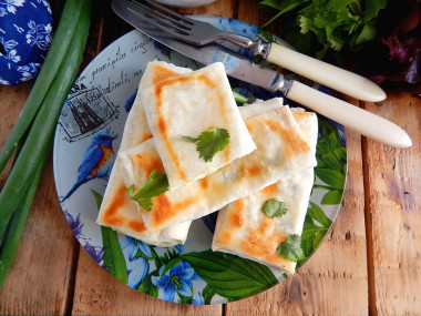 Pita bread envelopes in a frying pan