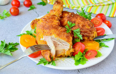 Chicken in breadcrumbs in a frying pan