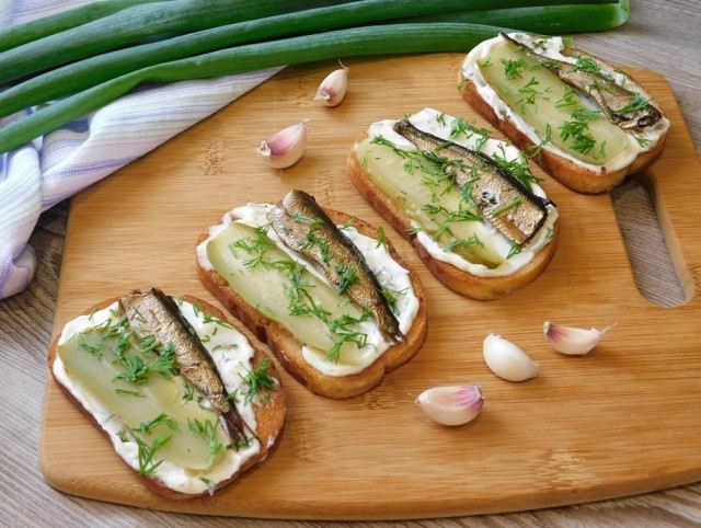 Sandwiches with sprats and pickled cucumber