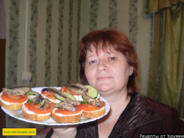 Sandwiches with mayonnaise sprats tomato and cucumber