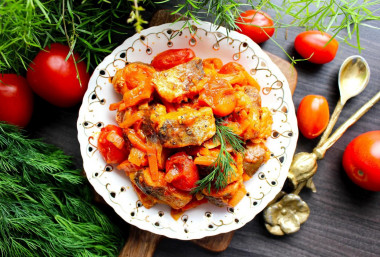 Fish with tomato paste, onions and carrots under marinade