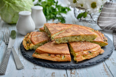 Cabbage filling pie with cabbage in a frying pan