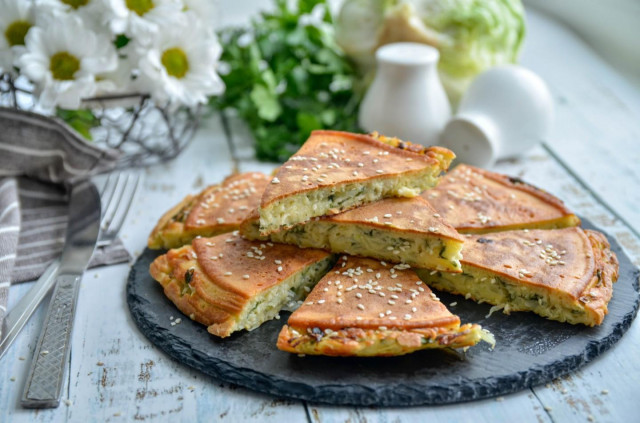 Cabbage filling pie with cabbage in a frying pan