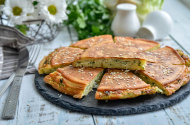 Cabbage filling pie with cabbage in a frying pan