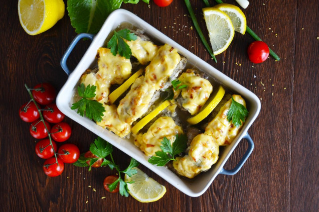 Pollock in the oven with mayonnaise and onions