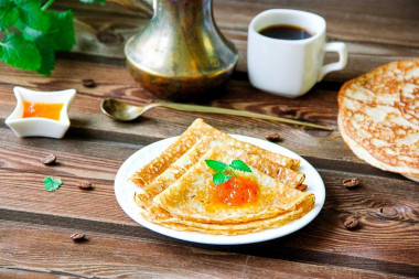 Pancakes with milk and kefir with thin holes