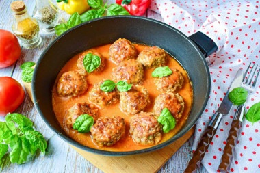 Meatballs with buckwheat in a frying pan