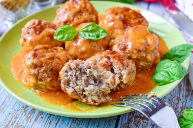 Meatballs with buckwheat in a frying pan